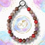 Beaded dog collar in reds, browns, and purple shades