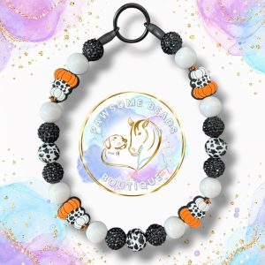 Black and white beaded dog collar with pumpkin beads