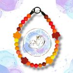 Beaded dog collar made from 15mm round silicone beads in autumn colours with maple leaf feature bead.