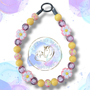 Beaded dog collar from Pawsome Beads Boutique with lilac and yellow beads with white flower feature bead