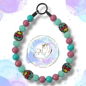 Handmade Queen of Beads dog collar featuring a bold crown statement bead and vibrant acrylic beads in fuchsia pink, turquoise and plum tones. A fun, stylish beaded collar designed for dogs who love to stand out. Perfect for fashionable pups and everyday royal walks.