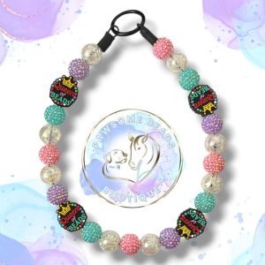 Handmade Queen of Beads dog collar featuring a bold crown statement bead and vibrant acrylic beads in fuchsia pink, turquoise and plum tones. A fun, stylish beaded collar designed for dogs who love to stand out. Perfect for fashionable pups and everyday royal walks.