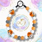 Jack-O’-Bones Halloween beaded dog collar with orange rhinestone, white and black striped beads and orange pumpkin skull focal beads.