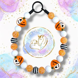 Jack-O’-Bones Halloween beaded dog collar with orange rhinestone, white and black striped beads and orange pumpkin skull focal beads.